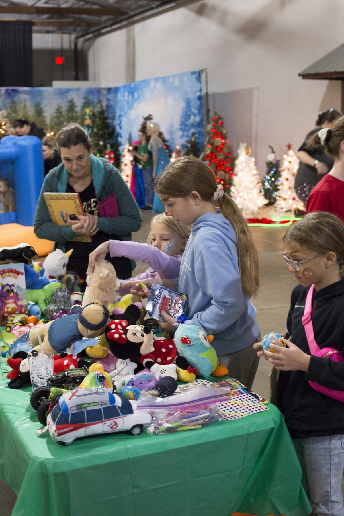 Children choosing toys and stuffies at Christmas Time