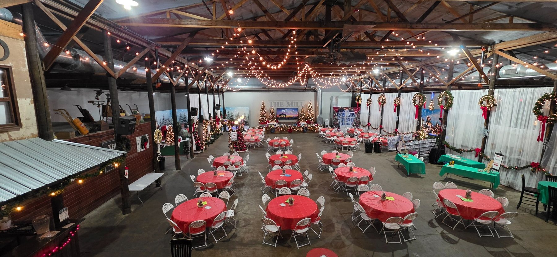 The Mill decorated for Christmas Time with lights, wreaths and red-covered tables