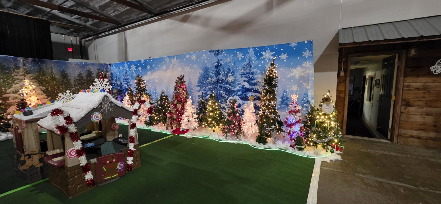 A group of decorated green and white Christmas Trees at The Mill